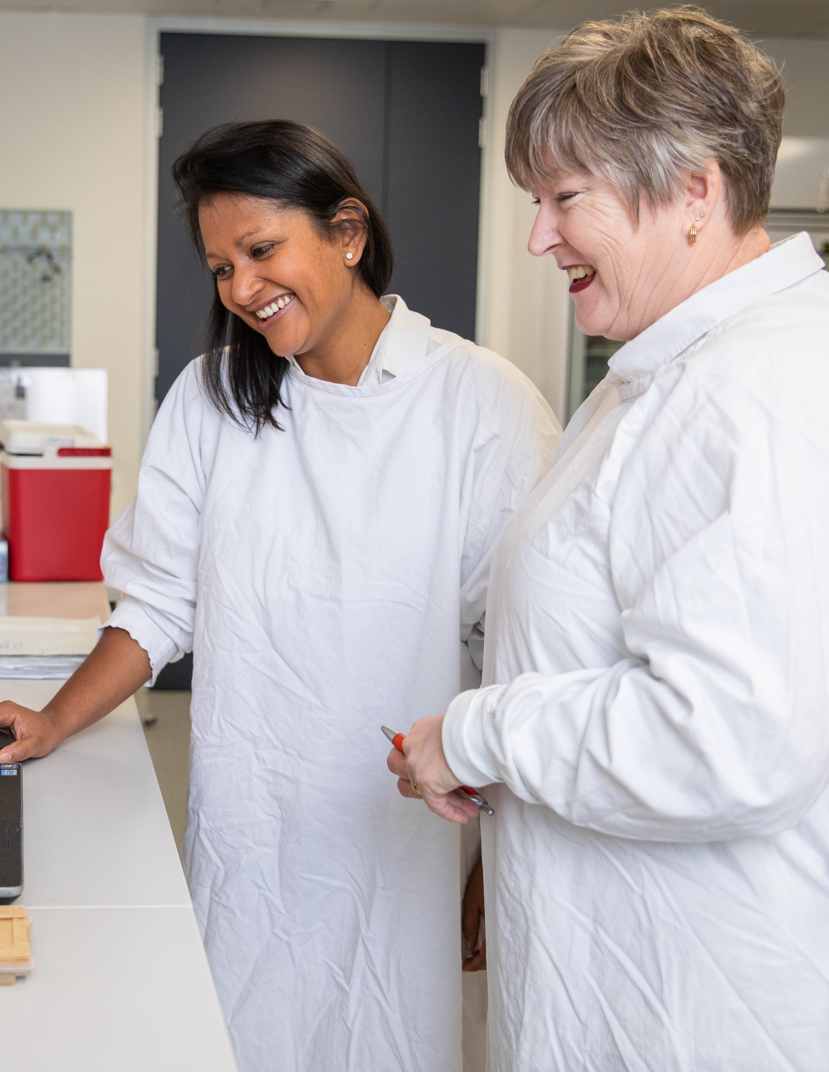 Female scientists looking at laptop_NSW Treasury Copyright_Image Credit Renee Nowytarger